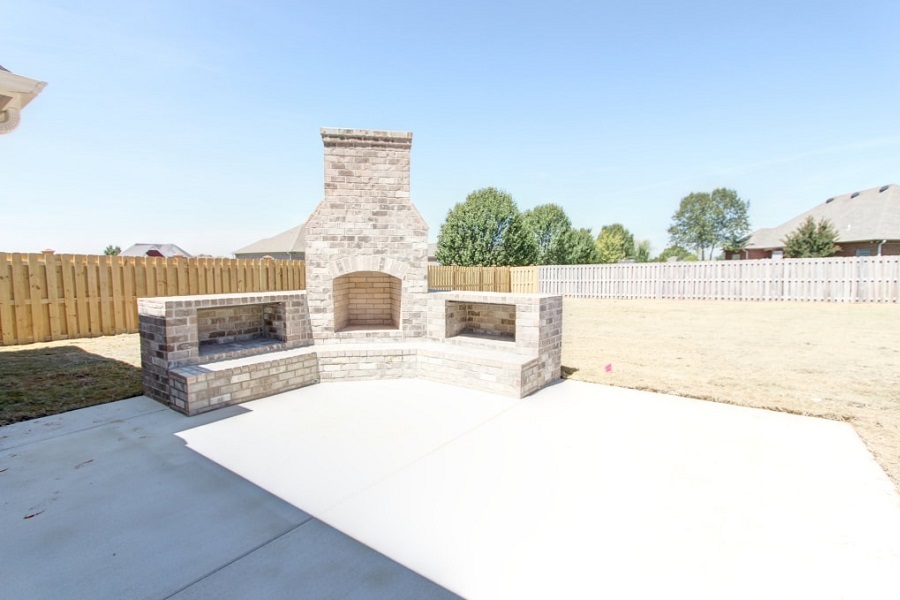 Outside Fireplace with two wood boxes